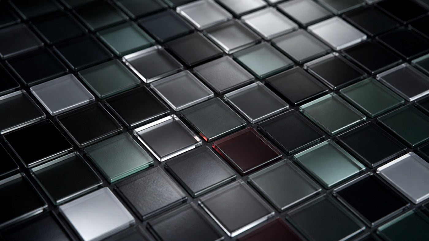 Small glass tiles of varying translucency in an ordered grid